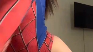 a beautiful girl in a spider-man costume