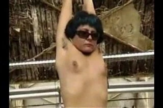 Arms suspended  from ceiling and flogging