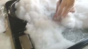 brunette washes her big tits in hydromassage