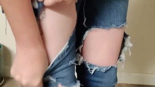 Ripped jeans destruction while wearing them