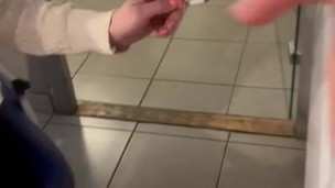 she sucks me while smoking her cigarette and i cum in her mouth at the office